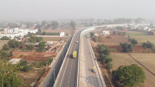Drone view of the traffic on the highway from a flyover in Punjab.