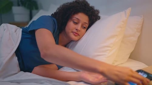 Woman in Bed Yawning, Looking at Phone, Sleeps