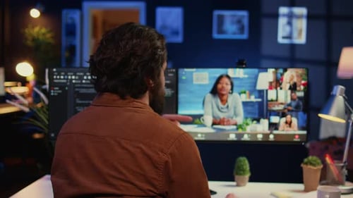 Man Attends Online Meeting in Home Office