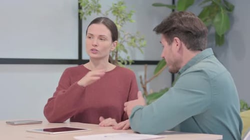 Young Business People Talking in Office