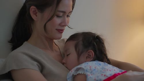 Mother and Child Embracing in Nighttime Comfort
