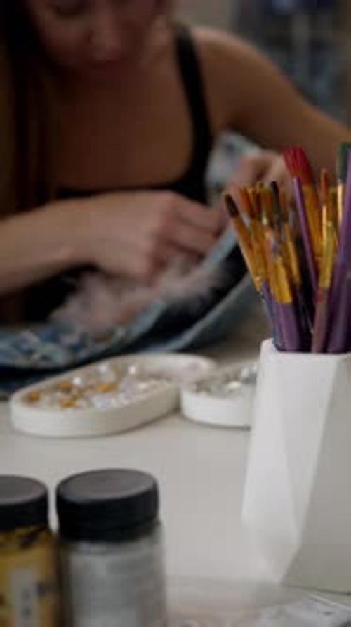 Craftswoman Creates Beautiful Pieces of Clothing and Decorates Them with Intricate Details In