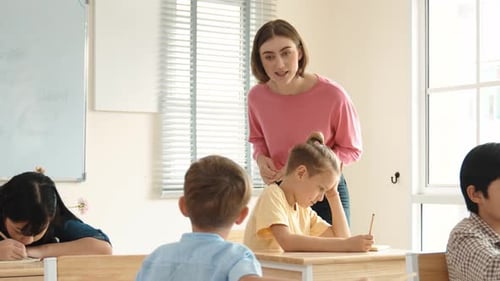 Teacher talking to students in a classroom
