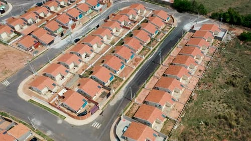 Aerial view of community houses in construction. Suburb popular houses. Community housing constructi