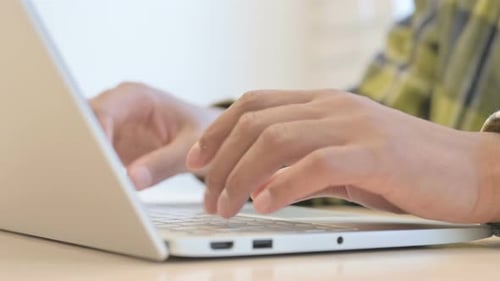 Hands of African Man Working on Laptop, Close up