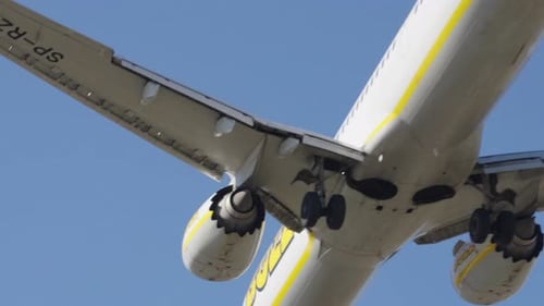 Airplane landing at airport runway during clear day