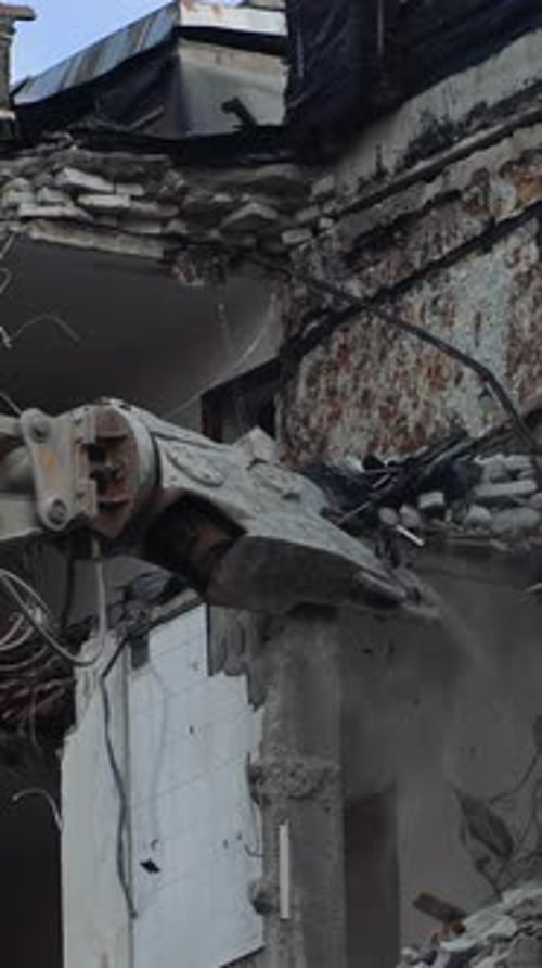 Demolition of the house previously destroyed by natural disaster.