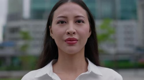 Close Up Portrait of the Charming Asian Lady Standing Outside on the Street with Make Up
