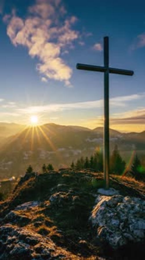 Vertical Video of Sunset Over Steel Cross