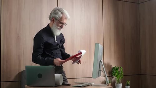 Elegant Grayhaired Scientist Checks Results of Research Thoughtful University Lecturer Checks