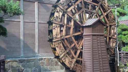 Traditional Wooden Waterwheel At Nan Lian Garden In Hong Kong