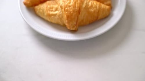 fresh butter croissant on plate