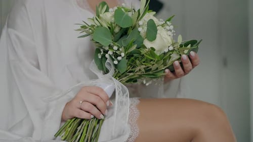 Bride Holds Elegant Wedding Flower Bouquet
