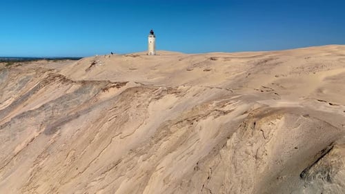 Explorez le phare de Rubjerg Knude Fyr dans le Jutland, au Danemark, avec de superbes dunes de sable
