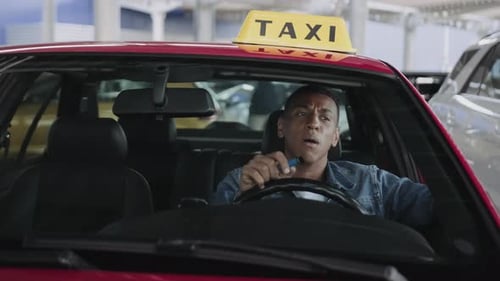 Tired Taxi Driver Yawns While Waiting in Vehicle
