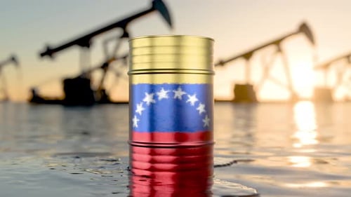 The camera zooms in on an oil barrel bearing the Venezuelan flag. Oil production in Venezuela. The p