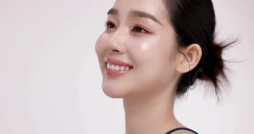 Slow motion of beautiful young Asian girl with k-beauty make up style.