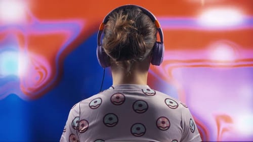 Person Listening to Headphones with Abstract Background
