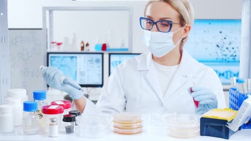 Woman Scientist Working in a Bright Lab