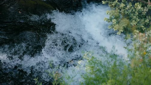 Top View of Flowing Water in Mountain River in Slow Motion