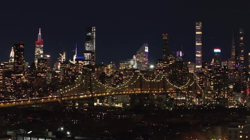 Illuminated New York City Skyline and Queensboro Bridge Create a Stunning Night Scene Camera