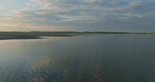 View of the Lake and Light Wave During Sunset