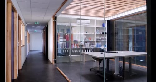 Beautiful office with glass wall interior view.