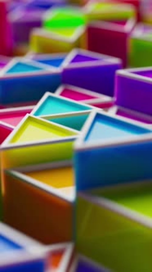 Looped animation of colorful plastic triangles in soft focus.