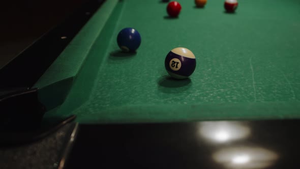 Closeup of a Pool Billiard Table on Which a White Ball is Rolling It ...