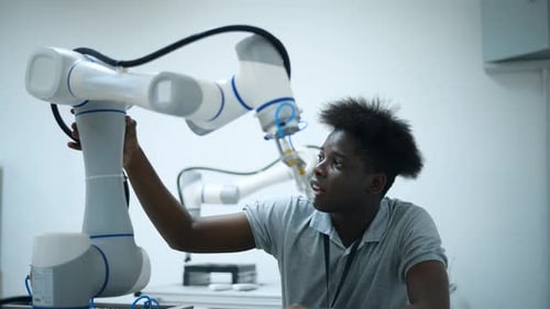 Trainee Robotics engineer learning with Programming and Manipulating Robot Hand