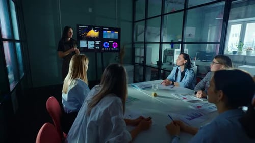 Group Of Businesswomen Discussing New Business Project Young Lady Speaking In Front Of Partners