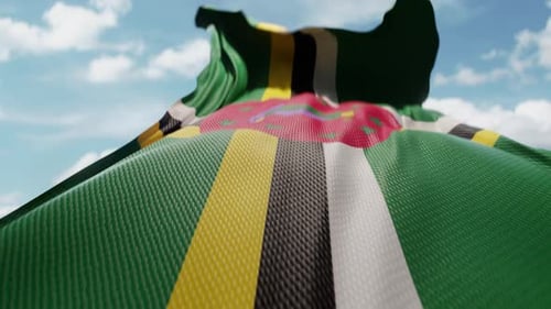 Dominica Flag Waving Realistically In Blue Sky