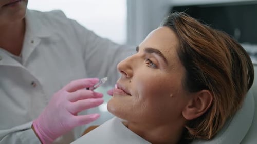 Beautician Injecting Woman Face in Cosmetology Clinic for Lifting Close Up