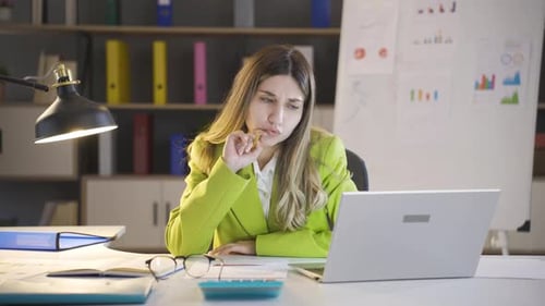 Woman working in the office at night.