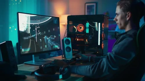 Young Man Gaming at Home at Night