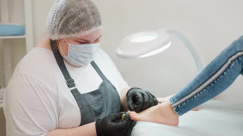 Beautician Performs Detailed Pedicure on Client in Salon