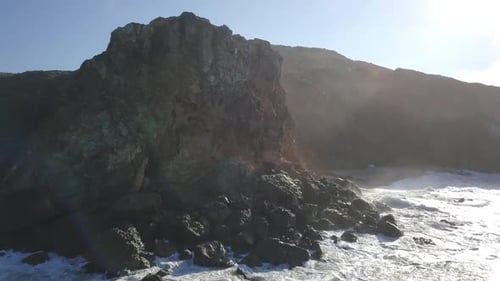 Aerial viewof beautiful beach with cliff. Ocean videos. drone shot away.