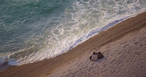 Couple Sits on the Ocean and Admires the Big Sea Waves Etretat is Located on the Coast of the