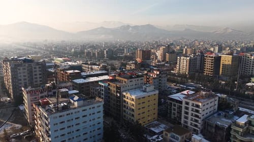 Landscape of Kabul, Afganistan apartments and sown mountains view.