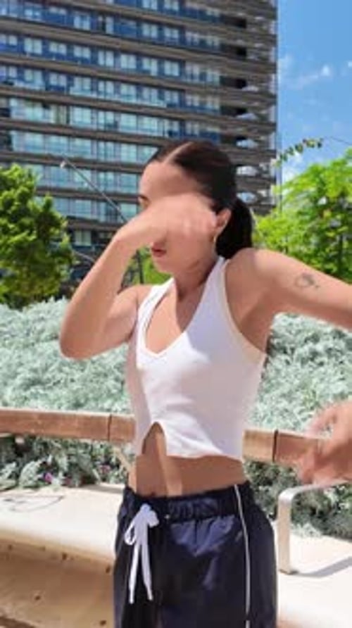 Young Woman Dances in Urban Environment