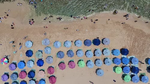 Crowded Summer Beach Aerial View of Umbrellas Sand and Ocean Waves