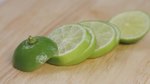 Sliced Limes on Wooden Cutting Board