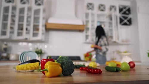 Kitchen Scene with Vegetables and a Woman