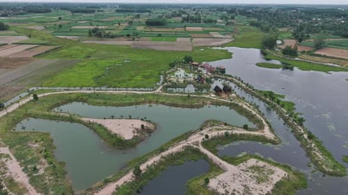 Aerial View Of A Landscape With Lakes Farms And Lush Greenery