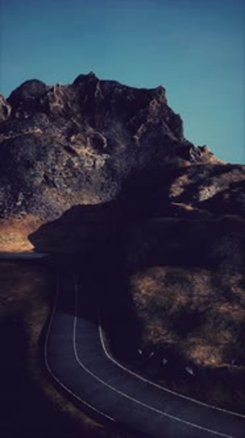 Winding Road Along Scottish Mountain
