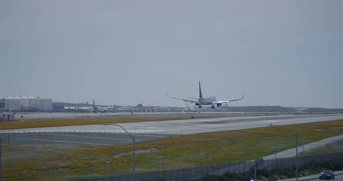 International Airport Airfield. Aircraft landing on runway, airplane taking off. Airport traffic. Co
