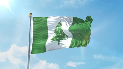 Norfolk Island Flag Waving Proudly Against Blue Sky