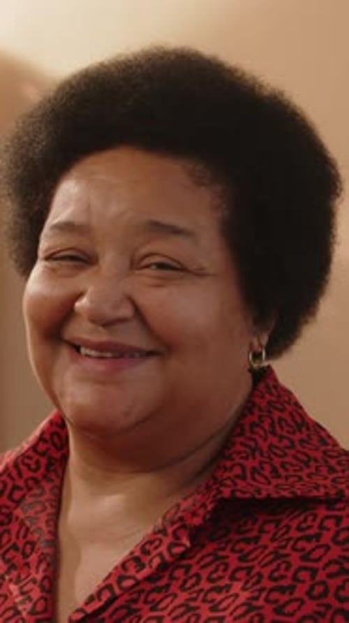 Smiling Woman Poses in Indoor Portrait