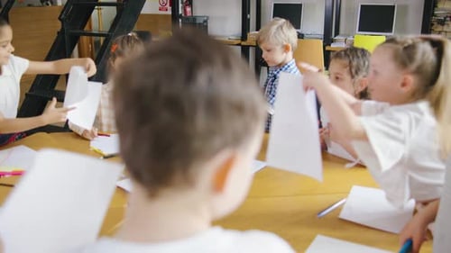 Engaged Children Drawing Together at a Table