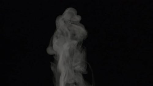 White Smoke Rising on a Black Background